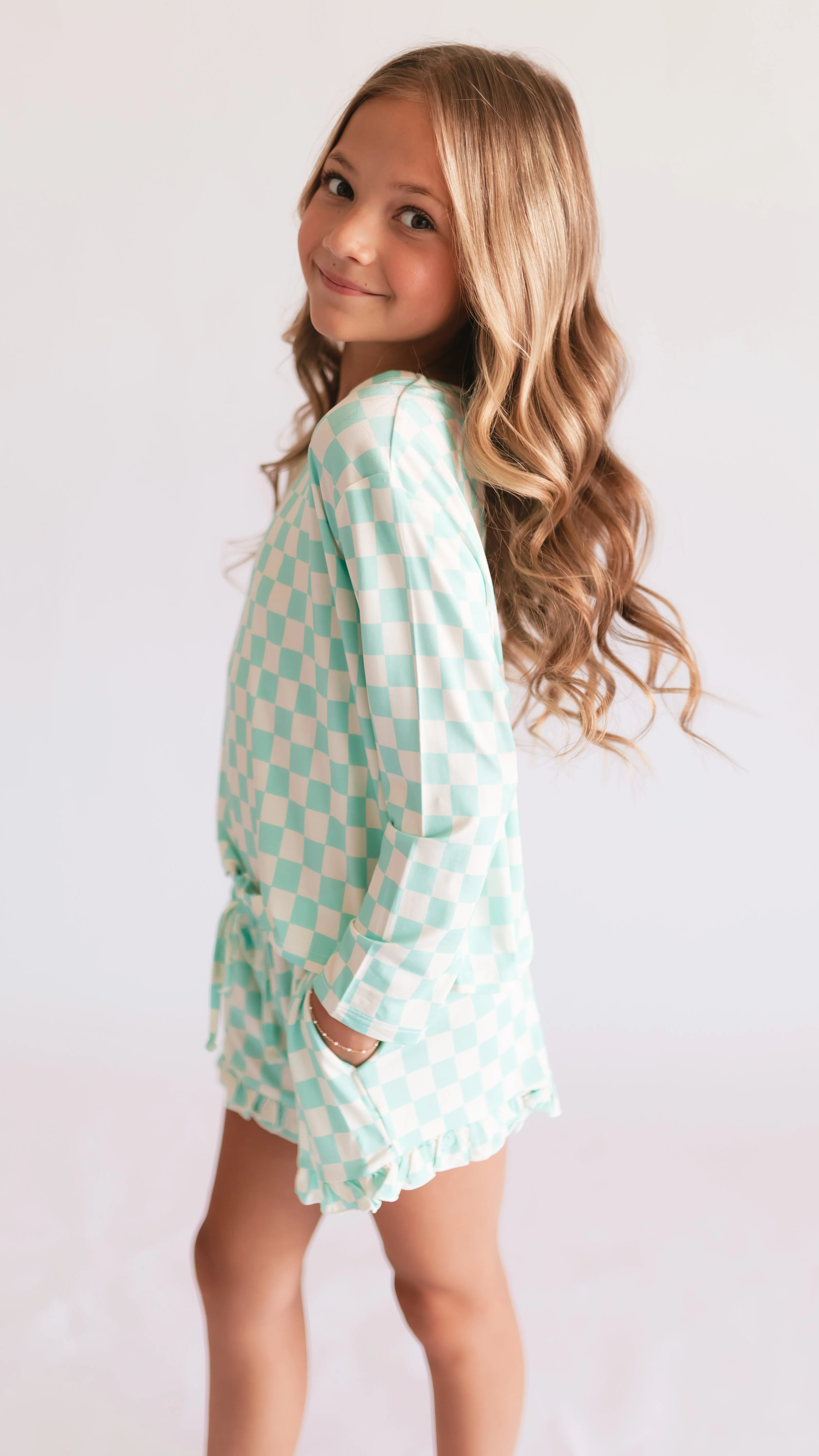 Girl's Long Sleeve and Ruffle Shorts Set in Teal Neon Checkered - Image 3