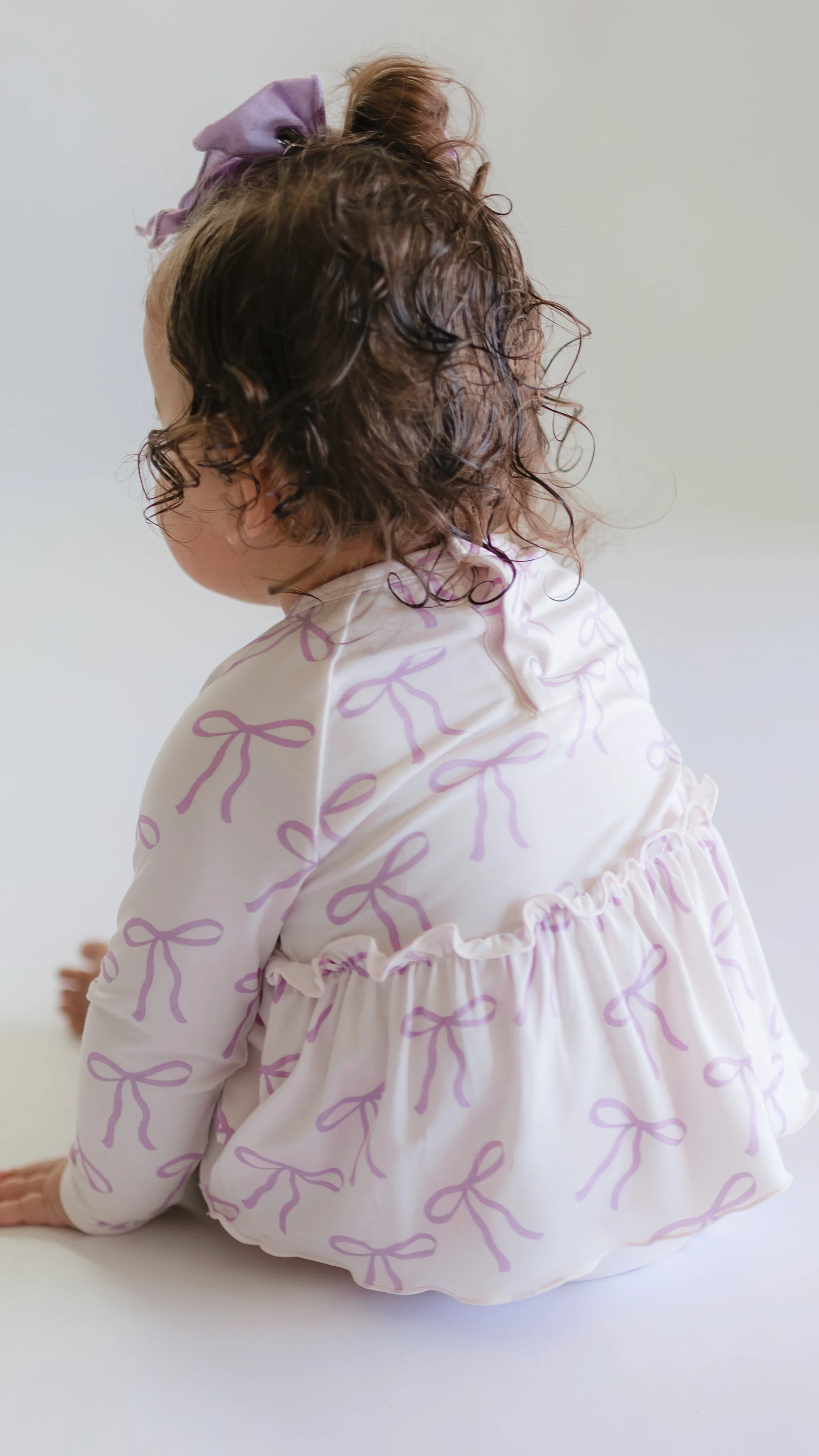 Infant Long Sleeve and Skirt Onesie in Purple Bows - Image 3